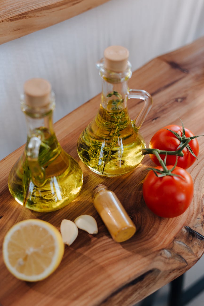 fresh tomatoes lemon garlic herbs and olive oil for preparing italian cuisine dish