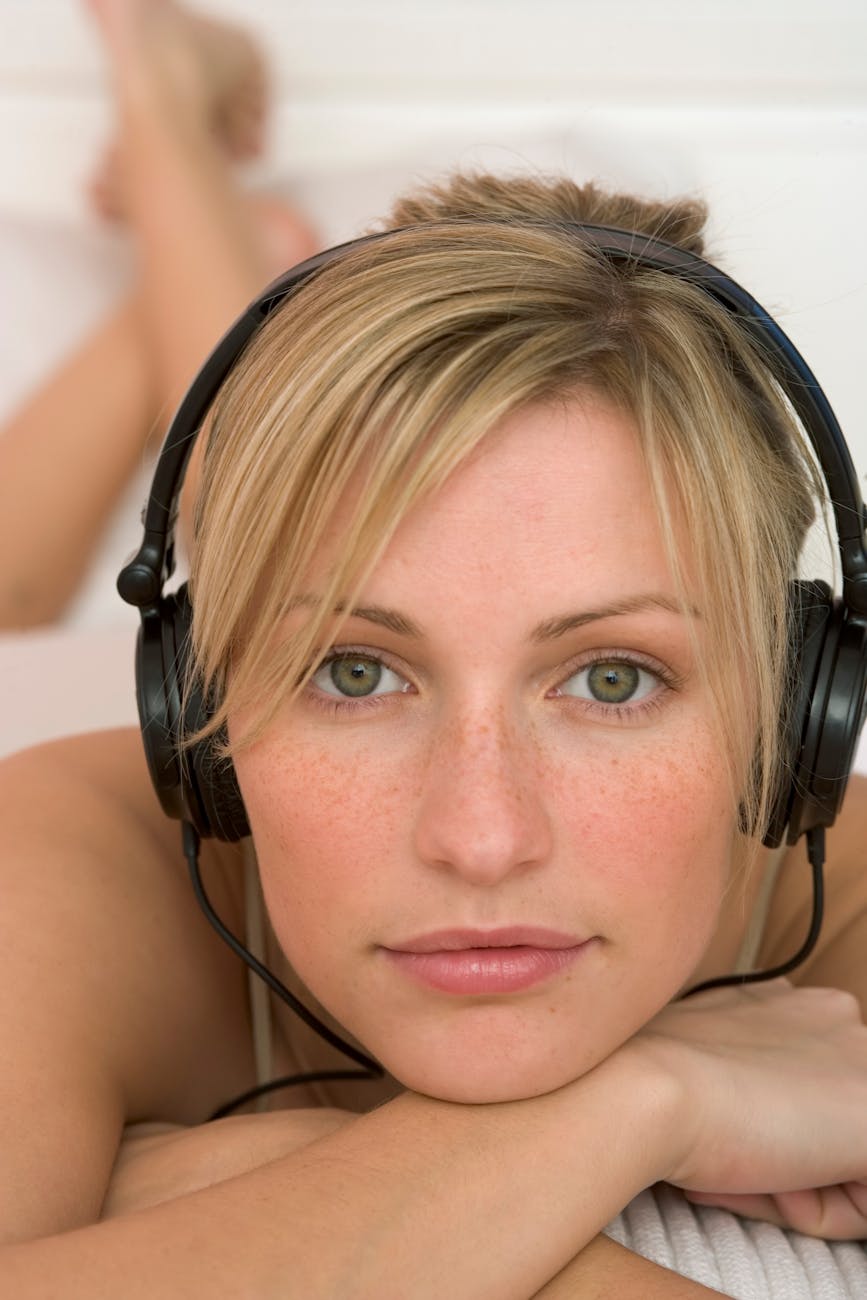 blonde lying in headphones