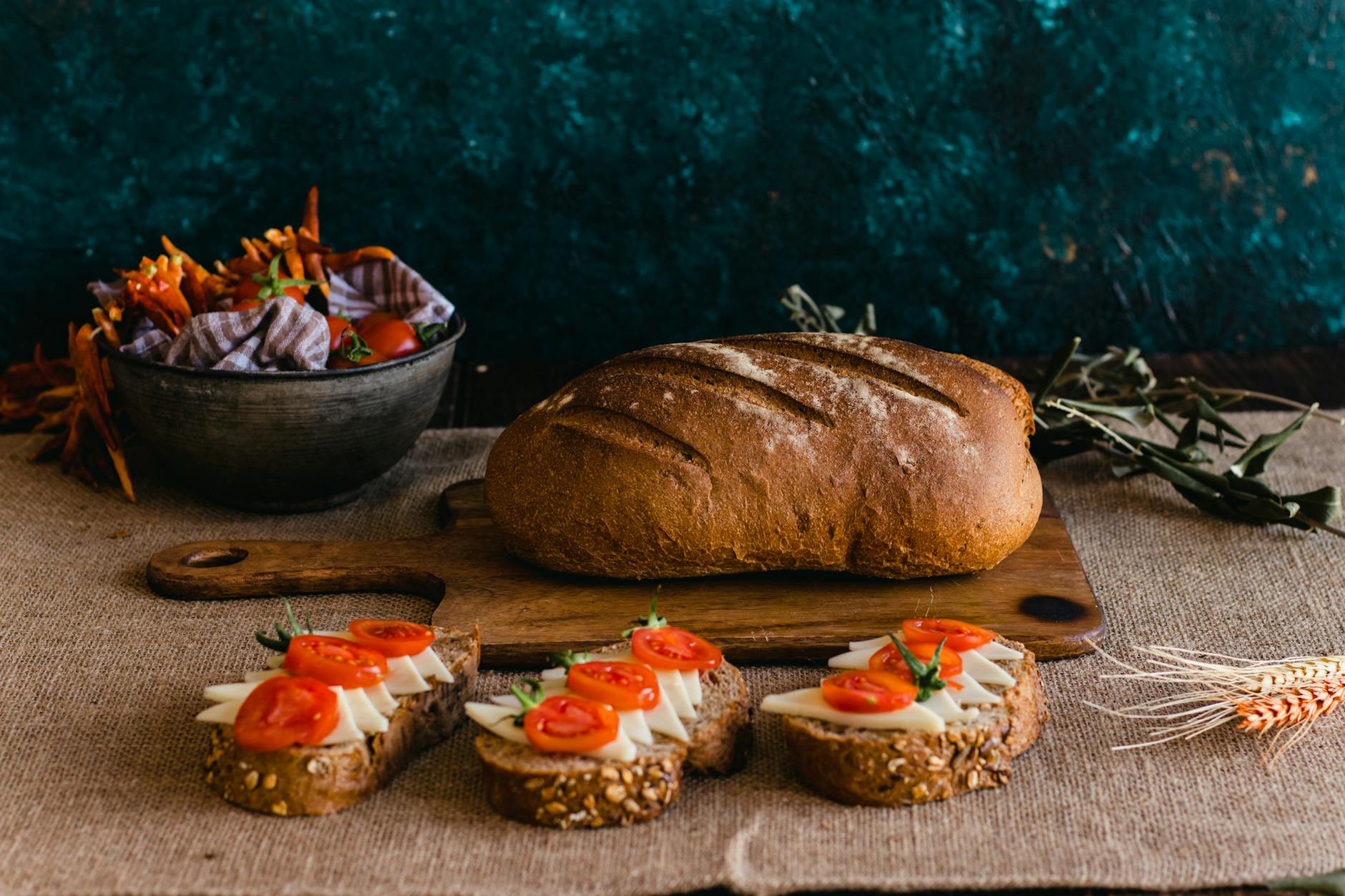 rustic loaf with slices of bread and cheese toppings