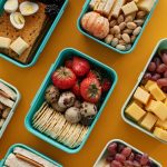 strawberries and eggs on green lunch box