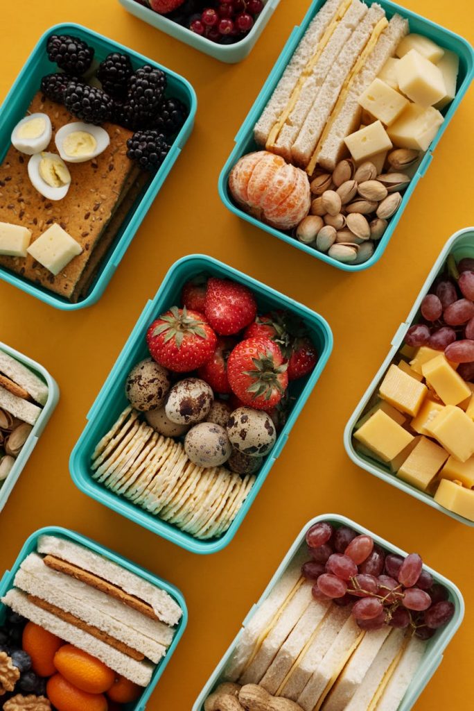 strawberries and eggs on green lunch box