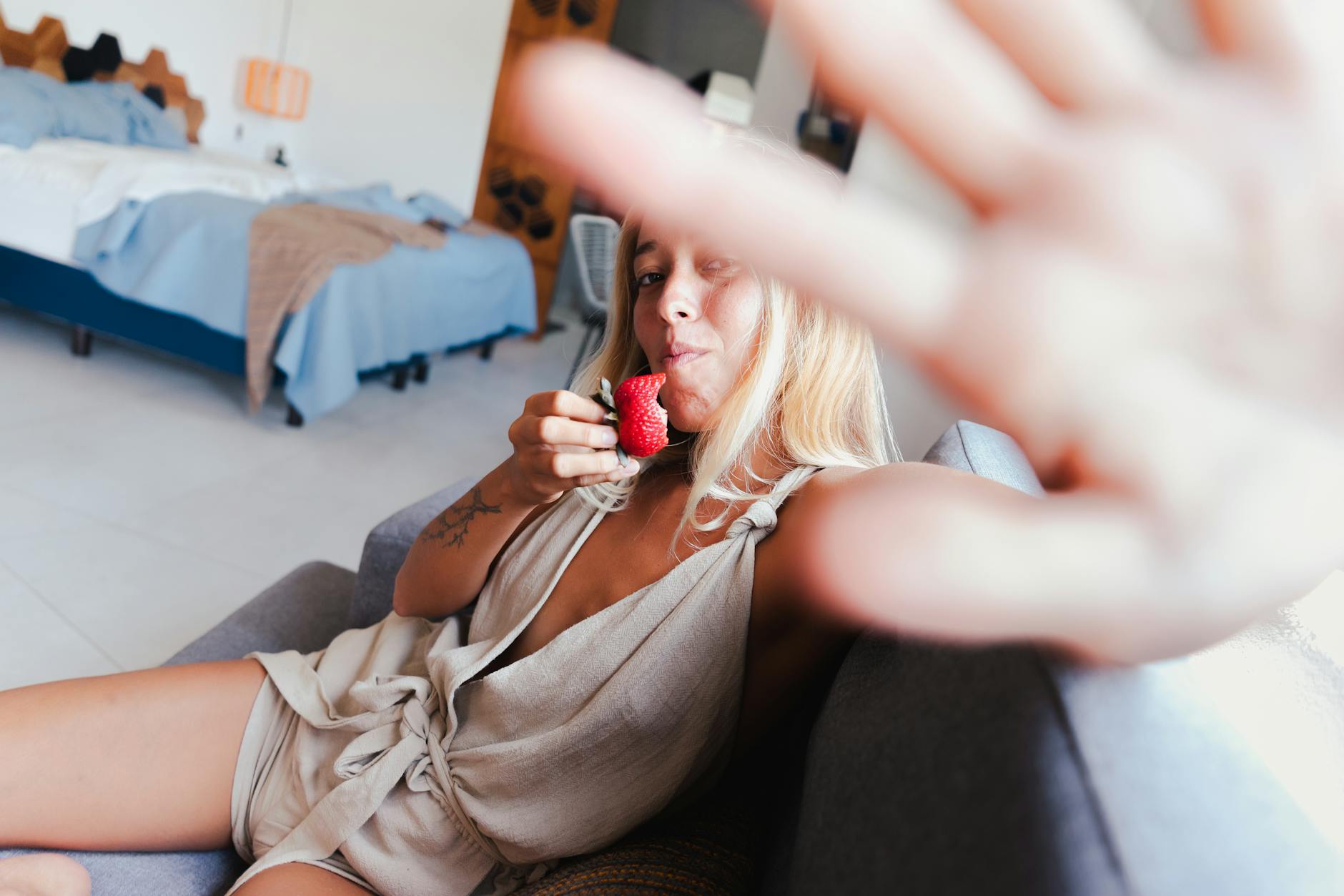 a woman eating a strawberry